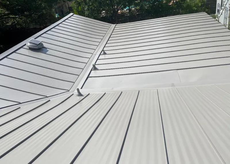 Solar attic fan installed on a metal roof for Roof Ventilation in Pacific Grove